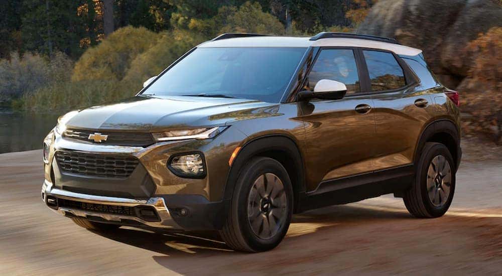 Brown 2021 Chevy Trailblazer driving to a used car dealership. 