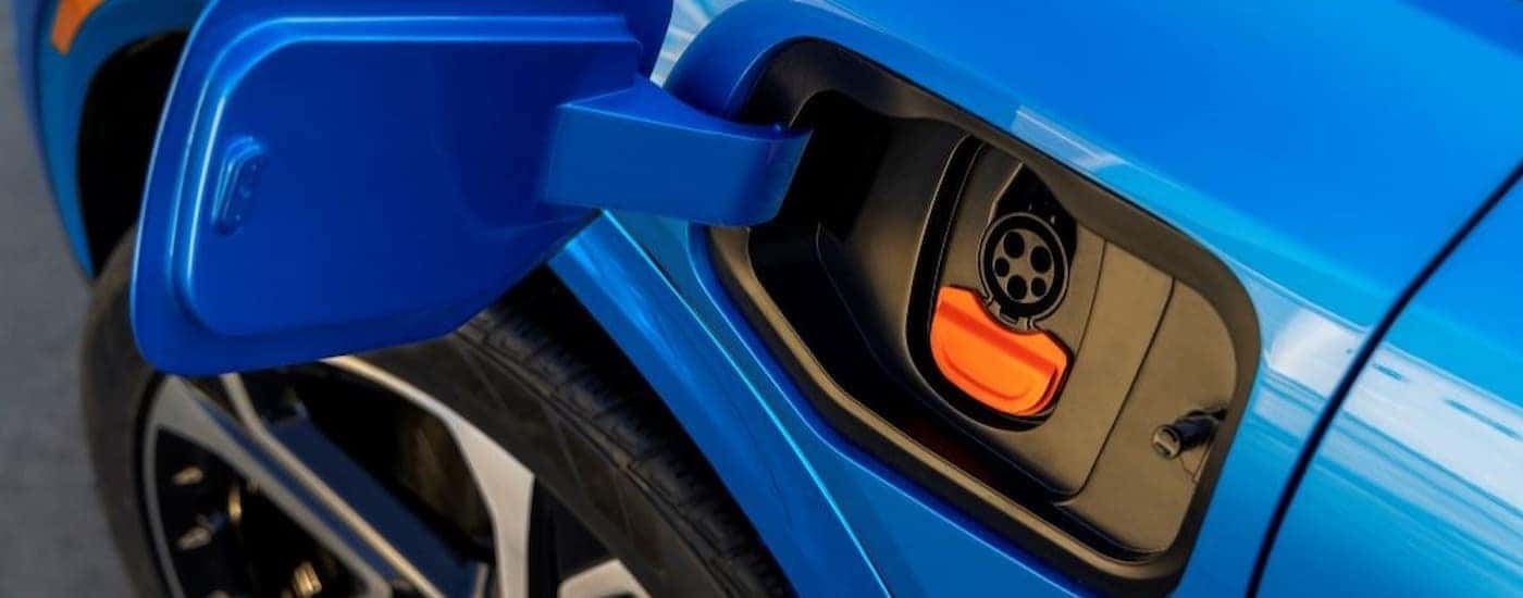Charging port on a blue 2025 Chevy Equinox EV