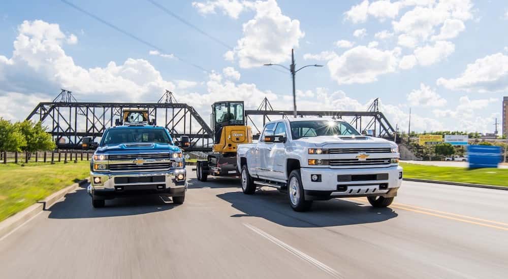 Two 2018 Chevy Silverado 2500HD towing side by side