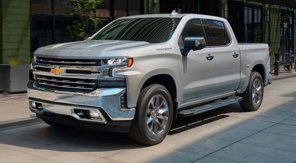 Silver 2019 Chevy Silverado 1500 driving to look at used trucks for sale
