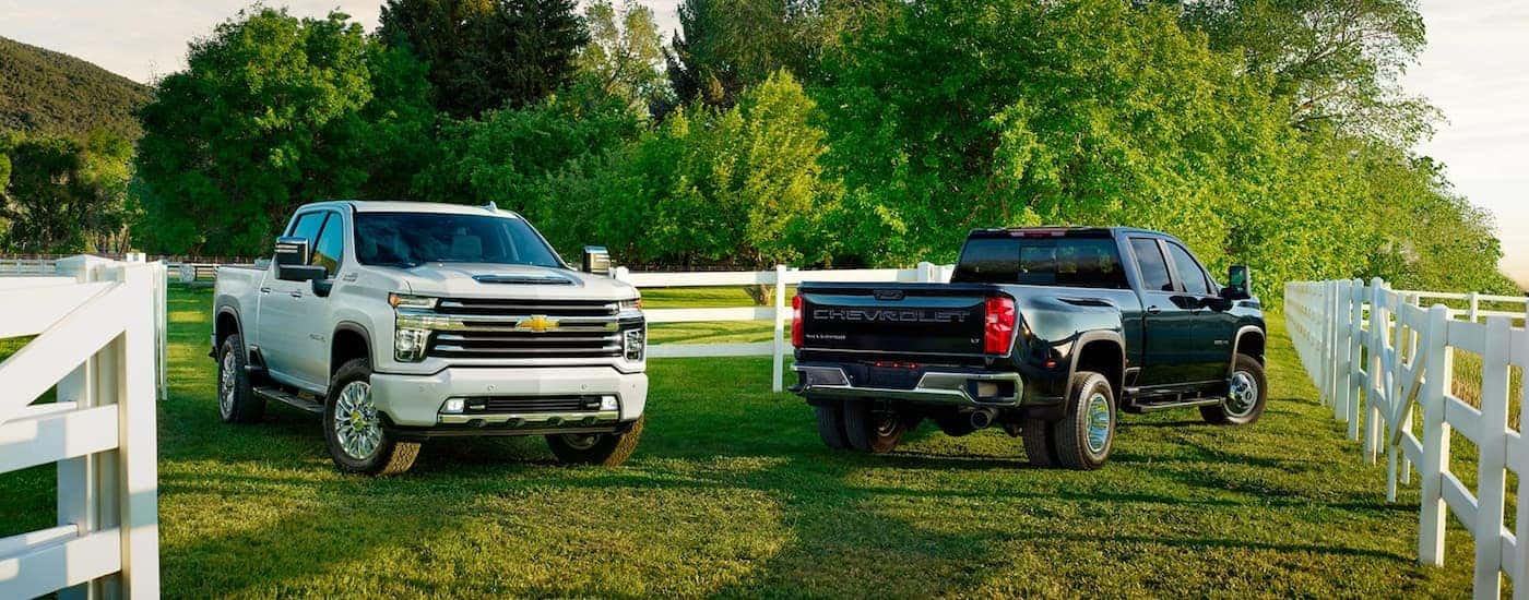 Two 2020 Chevy Silverado HD parked side by side