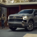 Silver 2026 Chevy Silverado parked in front of a house