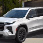 White 2026 Chevy Traverse parked in front of a house