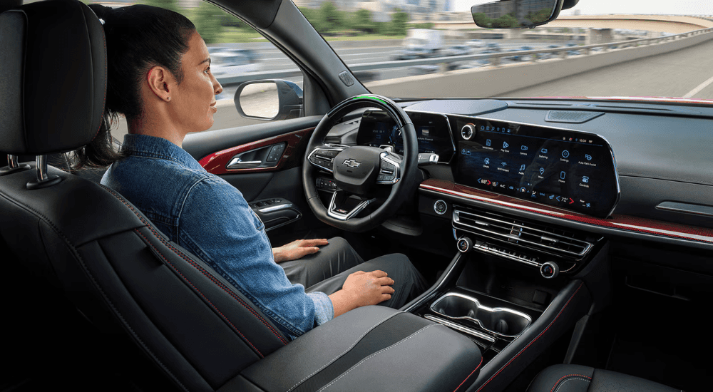 A person uses the Super Cruise feature on their 2026 Chevy Traverse