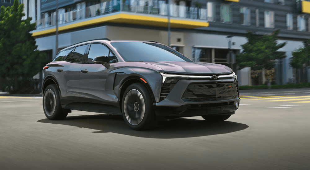 Grey 2026 Chevy Blazer RS driving through a city