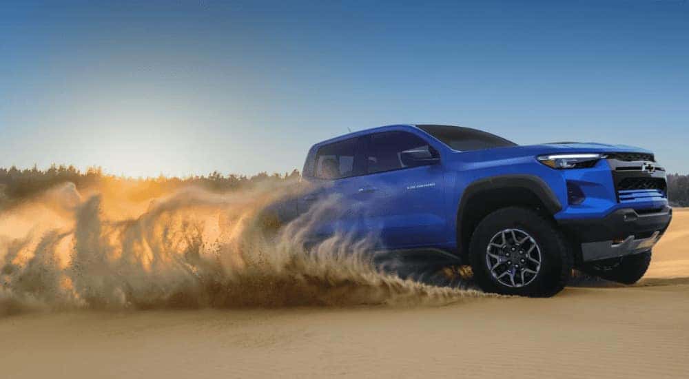 Blue 2026 Chevy Colorado ZR2 driving on sand