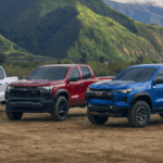 A white, a red, and a blue 2026 Chevy Colorado's parked side by side