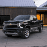 Black Chevy Silverado 3500 HD parked in front of a house