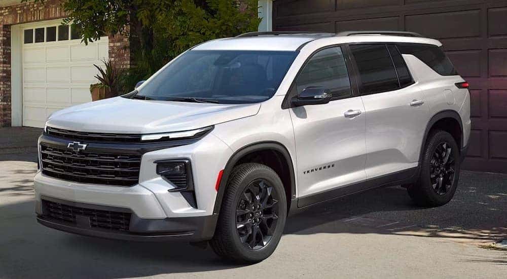 A white 2026 Chevy Traverse parked after visiting a Chevy dealer near Latham.