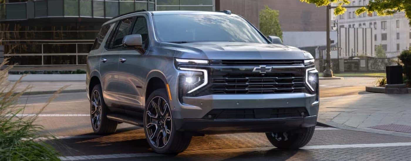 A gray 2025 Chevy Tahoe parked from a dealer near Latham