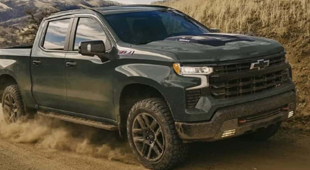 A green 2026 Chevy Silverado 1500 Z71 off-roading.