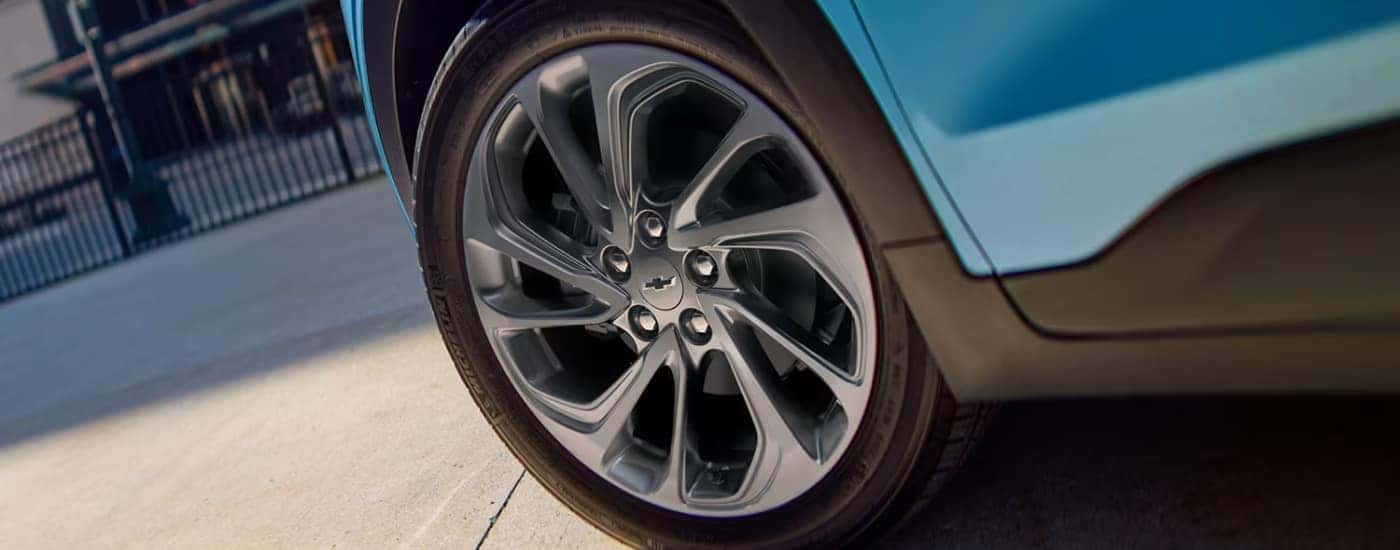 Close up of the wheel of a blue 2027 Chevy Bolt