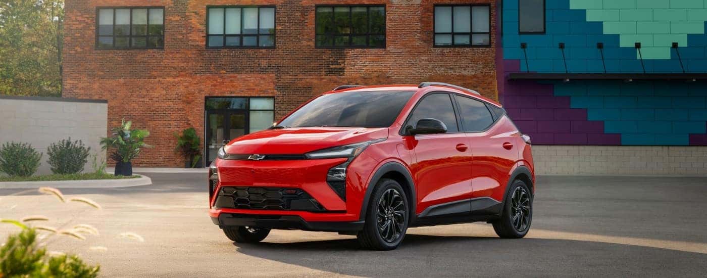 A red 2027 Chevy Bolt for sale near Troy from the front.