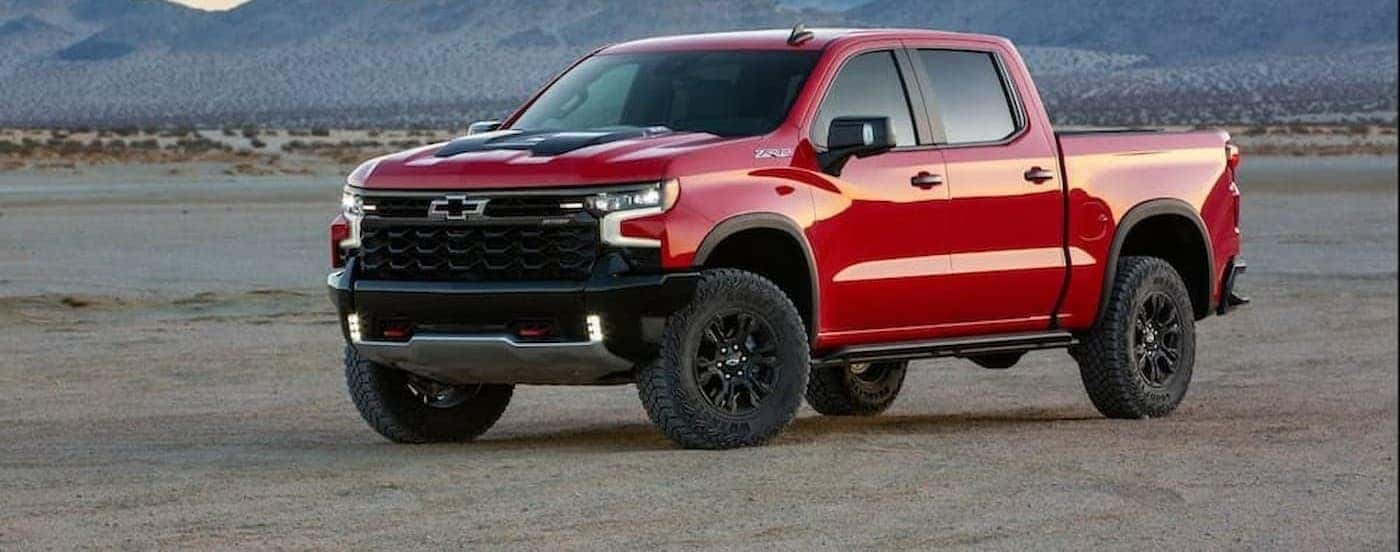 A red 2022 Chevy Silverado 1500 ZR2 parked offroad.