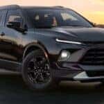 A black 2026 Chevy Blazer parked in a city.