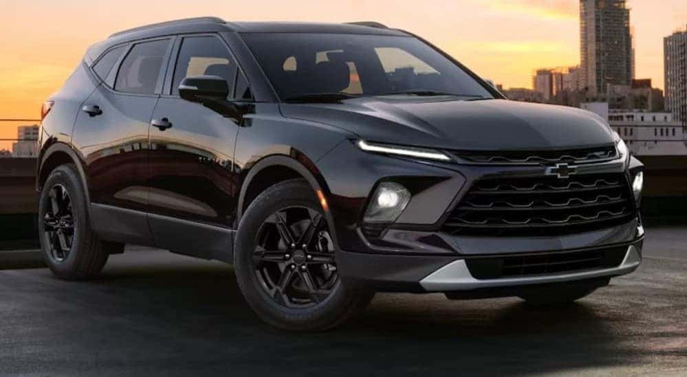 A black 2026 Chevy Blazer parked in a city.