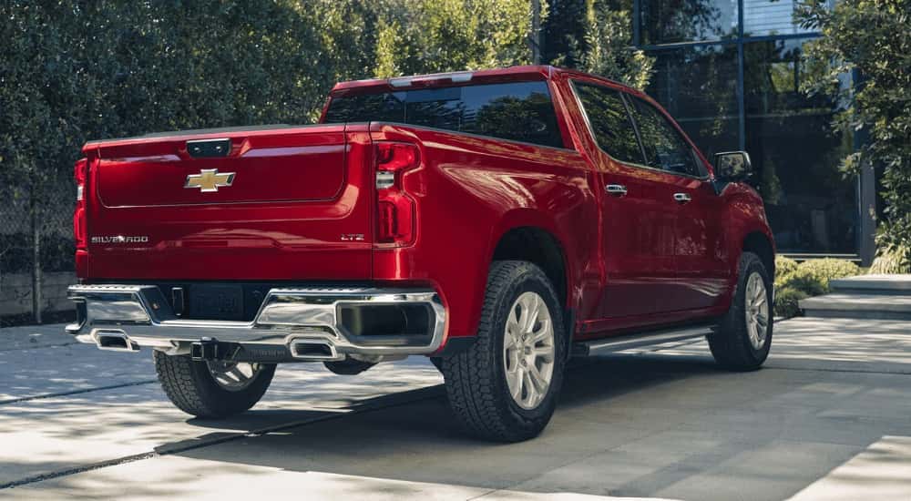 Red 2026 Chevy Silverado 1500 LTZ in a driveway