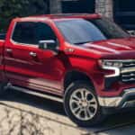Red 2026 Chevy Silverado 1500 parked on a driveway.