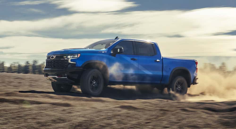 Blue 2026 Chevy Silverado 1500 ZR2 drifting off-road