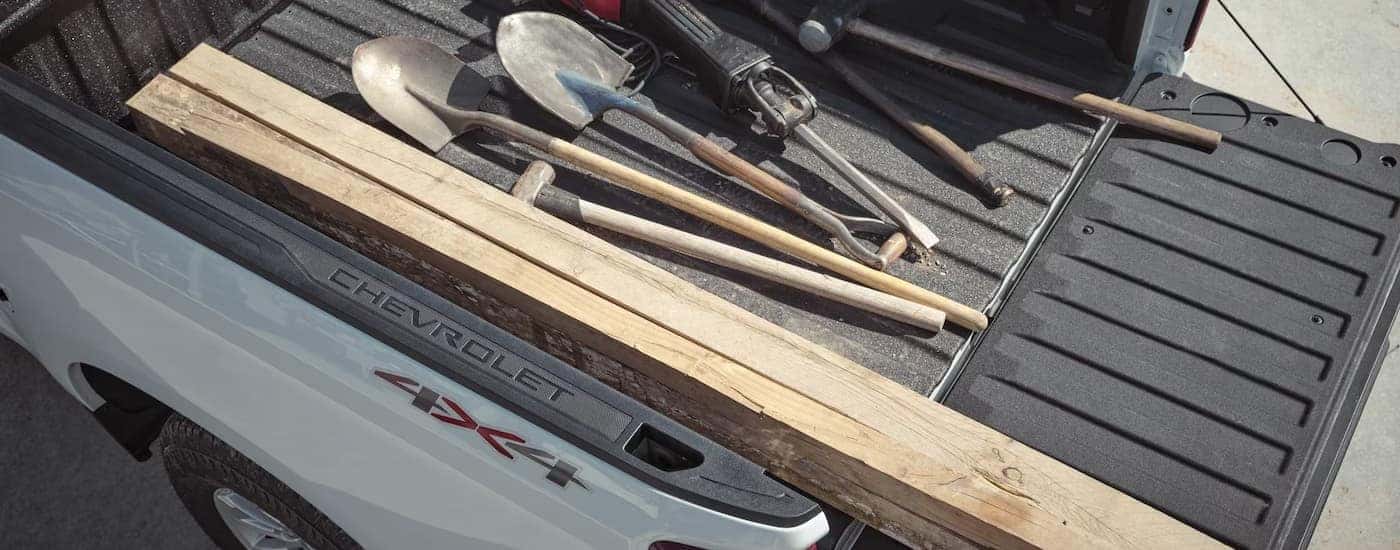 Tools in the bed of a 2026 Chevy Silverado 1500.
