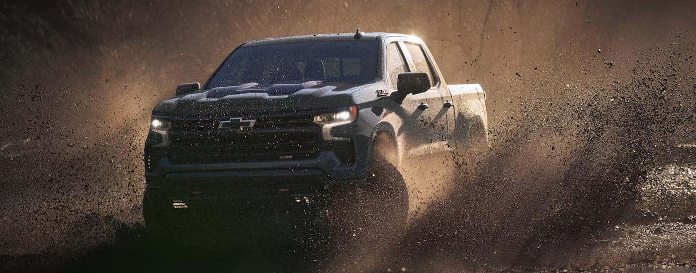 A blue 2026 Chevy Silverado 1500 ZR2 off-roading.