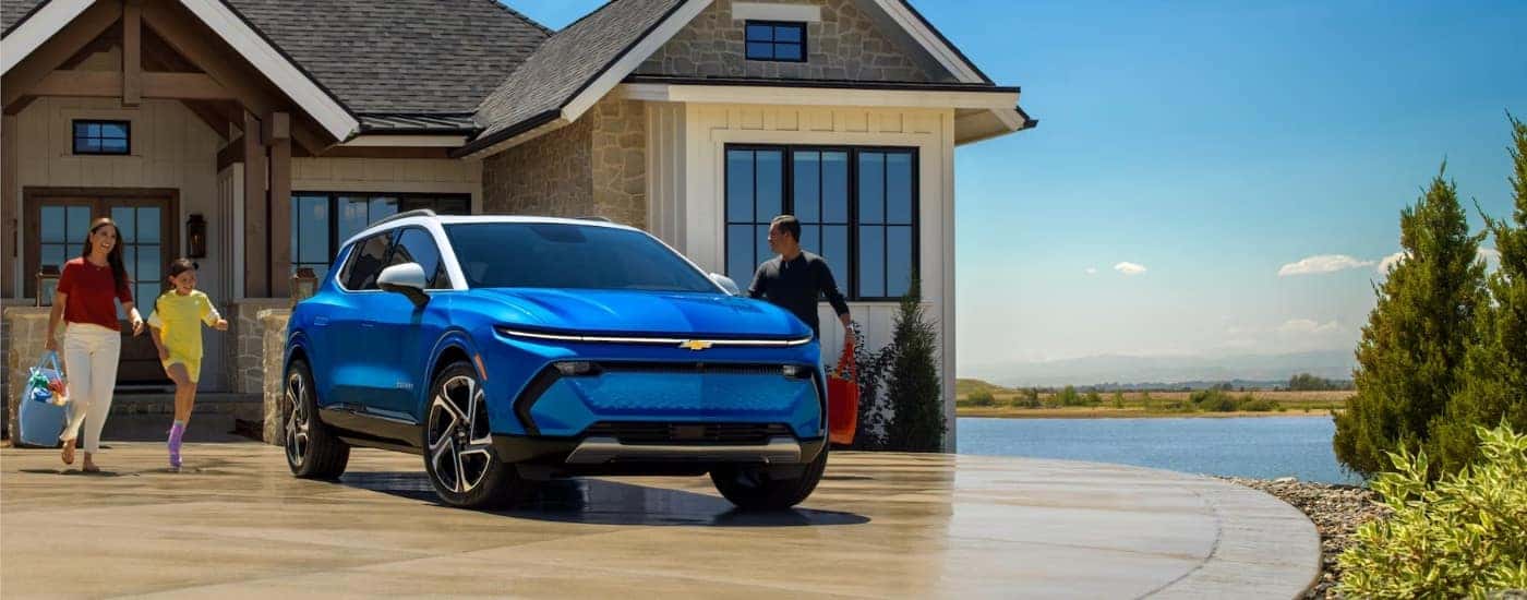 Blue 2024 Chevy Equinox EV for sale near Guilderland parked on a driveway