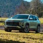 Green 2026 Chevy Equinox parked in a field