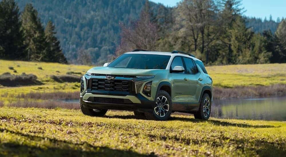 Green 2026 Chevy Equinox parked in a field