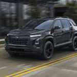 Black 2026 Chevy Equinox driving through a city