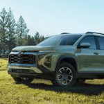 Green 2026 Chevy Equinox parked on a field