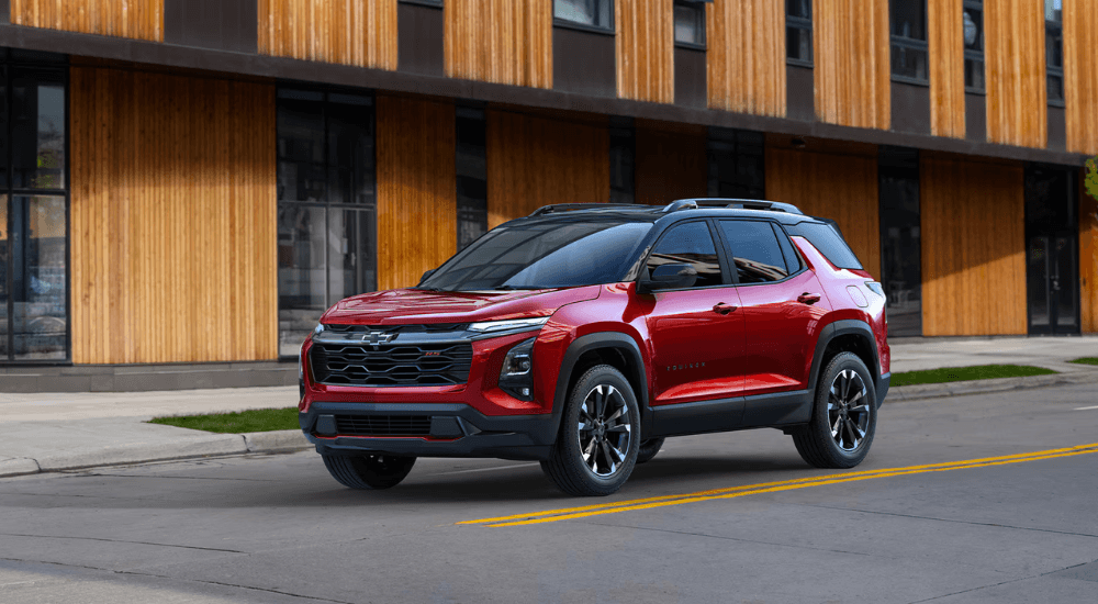 Red 2026 Chevy Equinox driving through a city