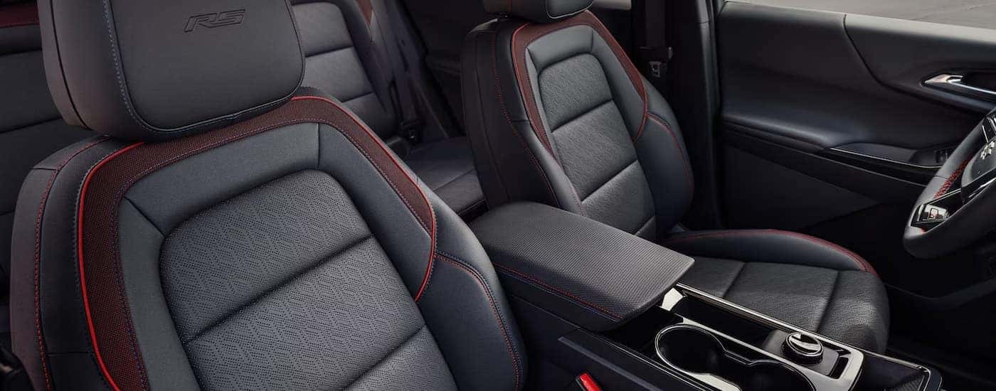 Black leather seating with red accents inside a 2026 Chevy Equinox