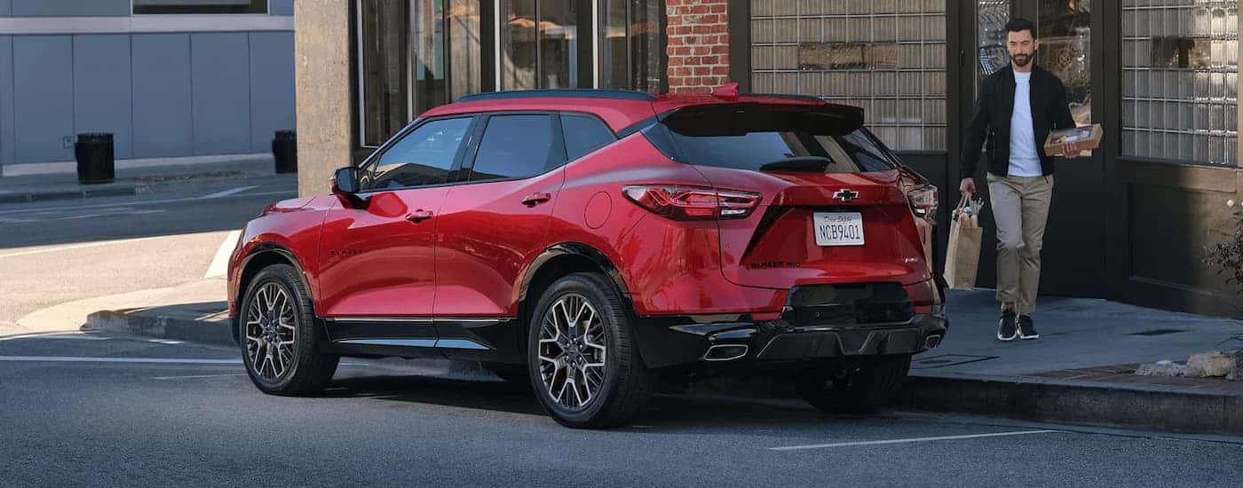 Red 2025 Chevy Blazer RS parked on the side of a street