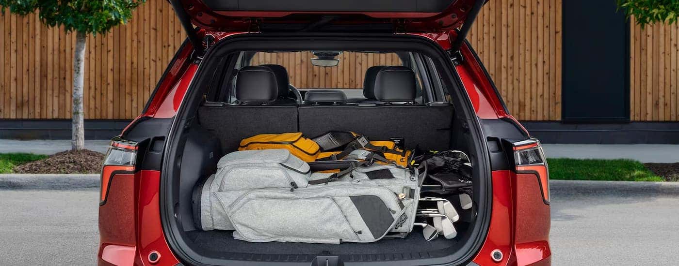 Golf gear the back of a red 2026 Chevy Equinox