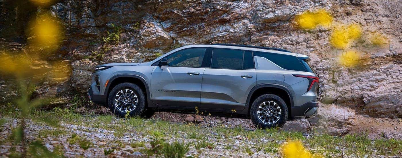 A silver 2026 Chevy Traverse off-road.