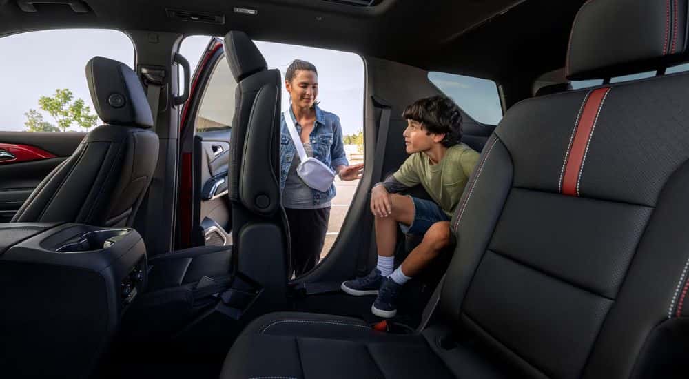 2026 Chevy Traverse black interior with a mom and child