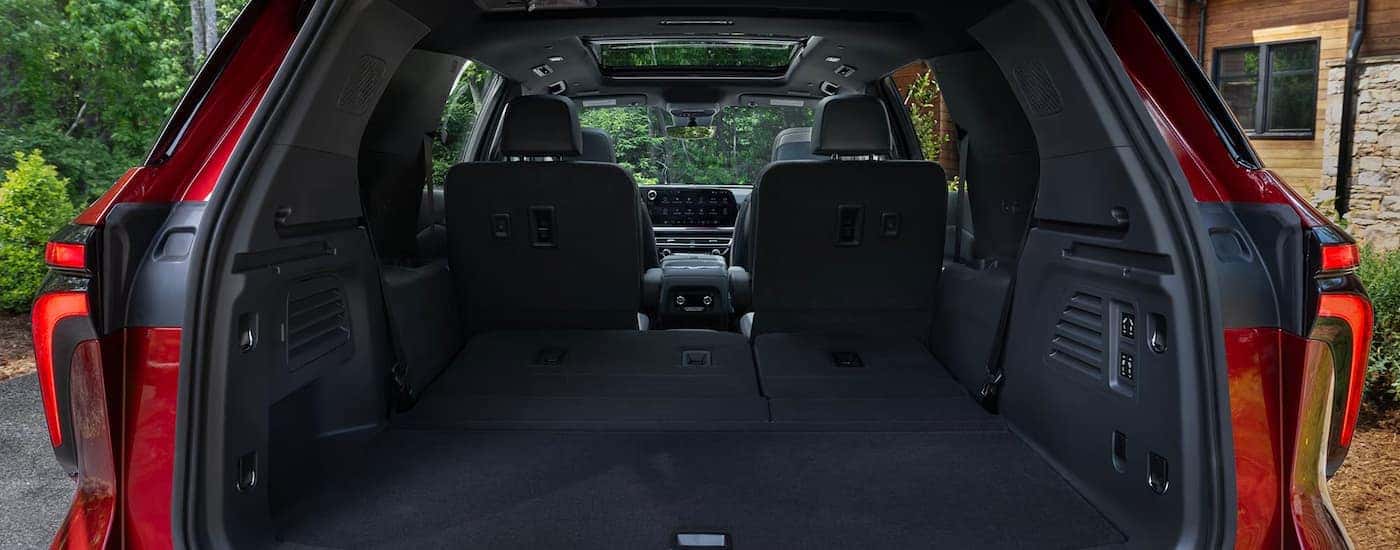 Cargo space inside a red 2026 Chevy Traverse