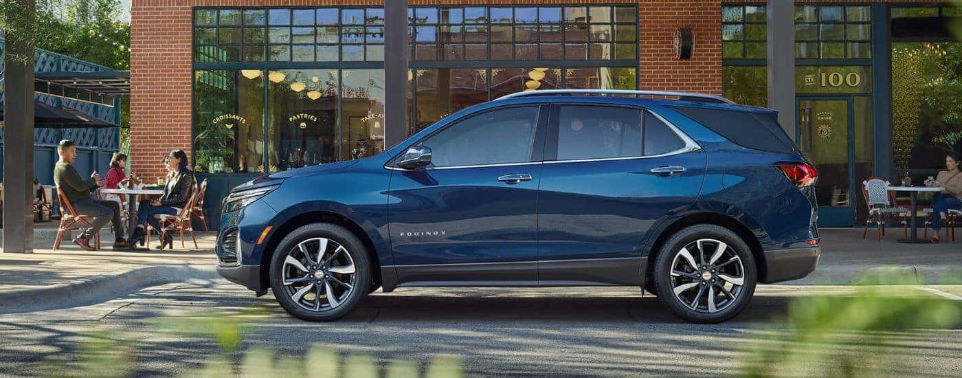 Blue 2022 Chevy Equinox parked outside of an office building.