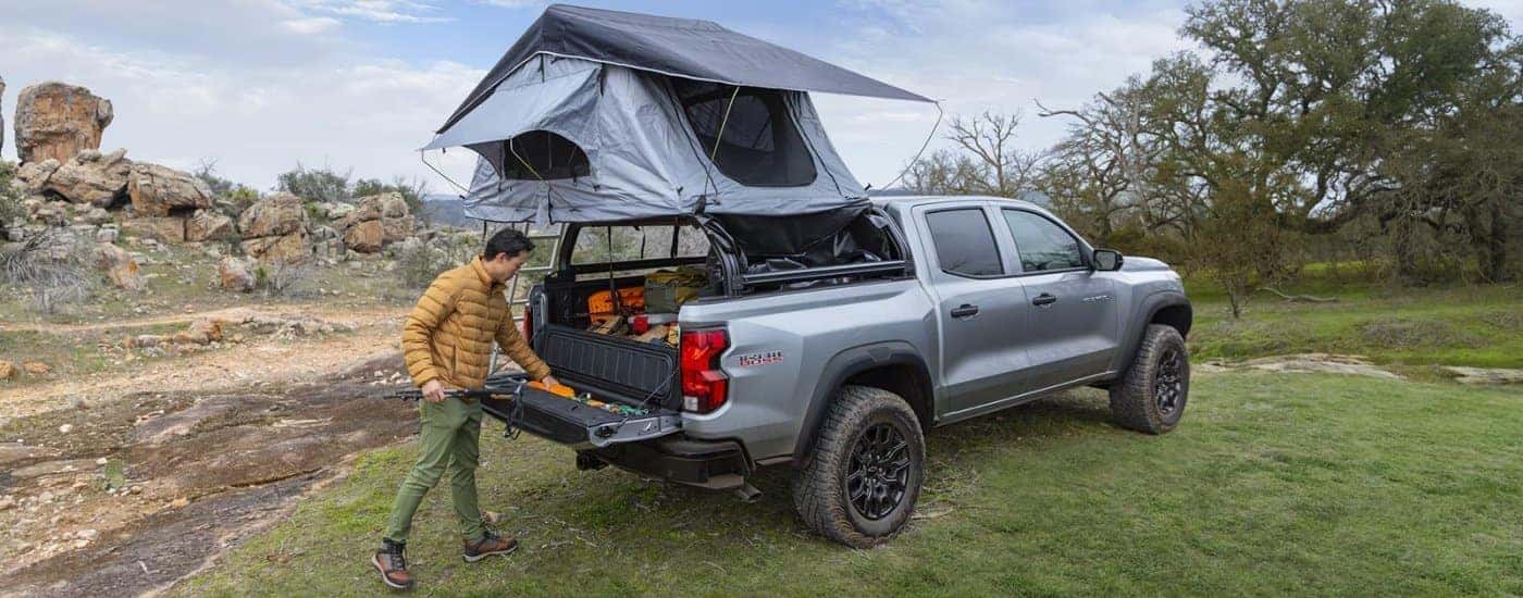 Silver 2026 Chevy Colorado Trail Boss with a tent over the bed.
