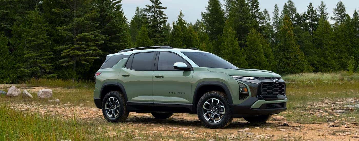 A green 2026 Chevy Equinox ACTIV parked off-road
