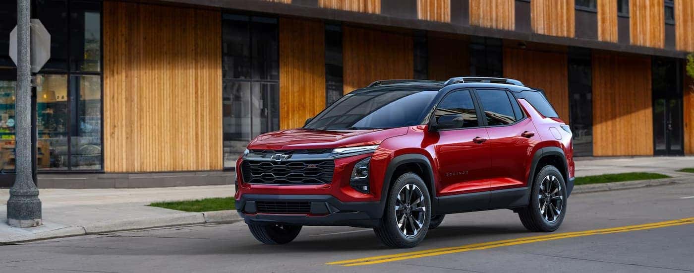 A red 2026 Chevy Equinox parked in a city