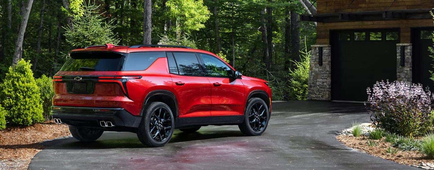 Red 2026 Chevy Traverse parked in a driveway.