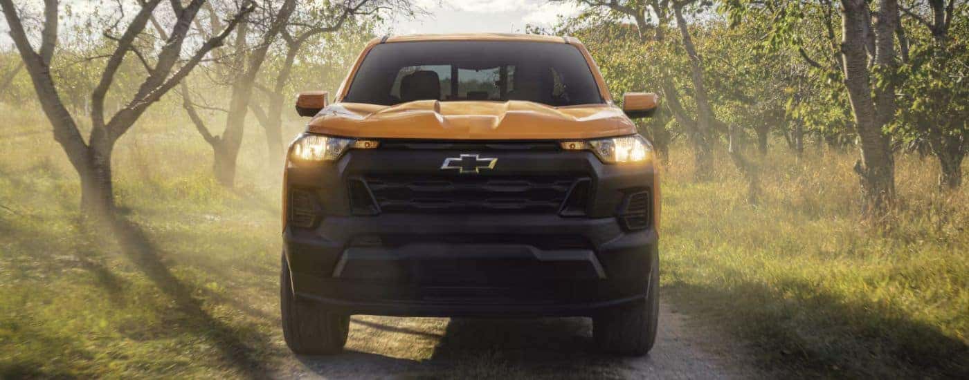 Yellow 2026 Chevy Colorado on a dirt road from the front.