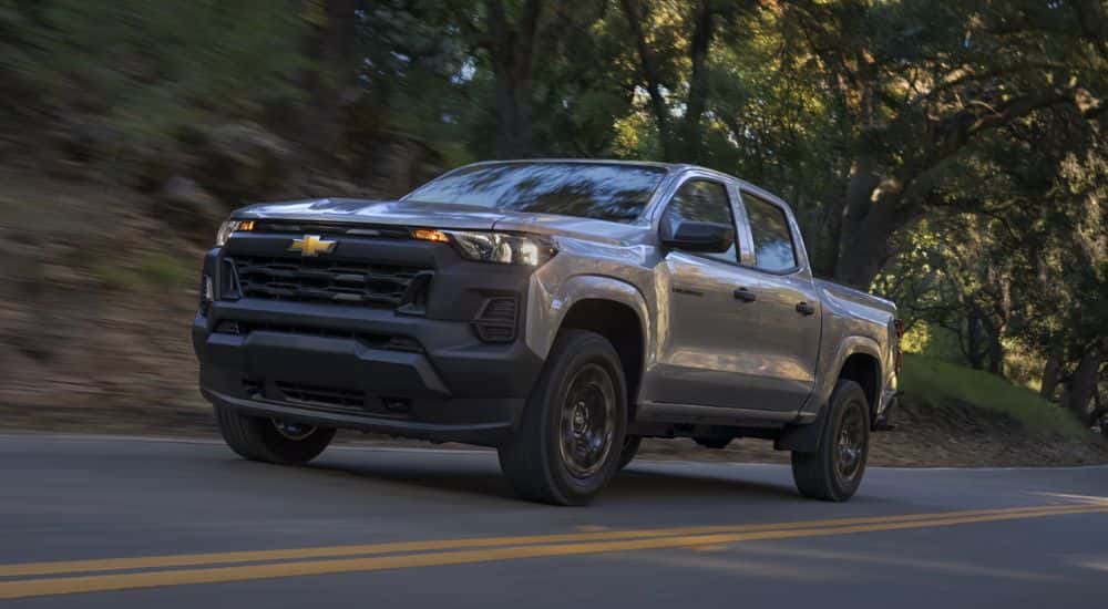 Silver 2026 Chevy Colorado Trail Boss with a tent over the bed.