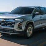 A silver 2026 Chevy Equinox driving on a highway.
