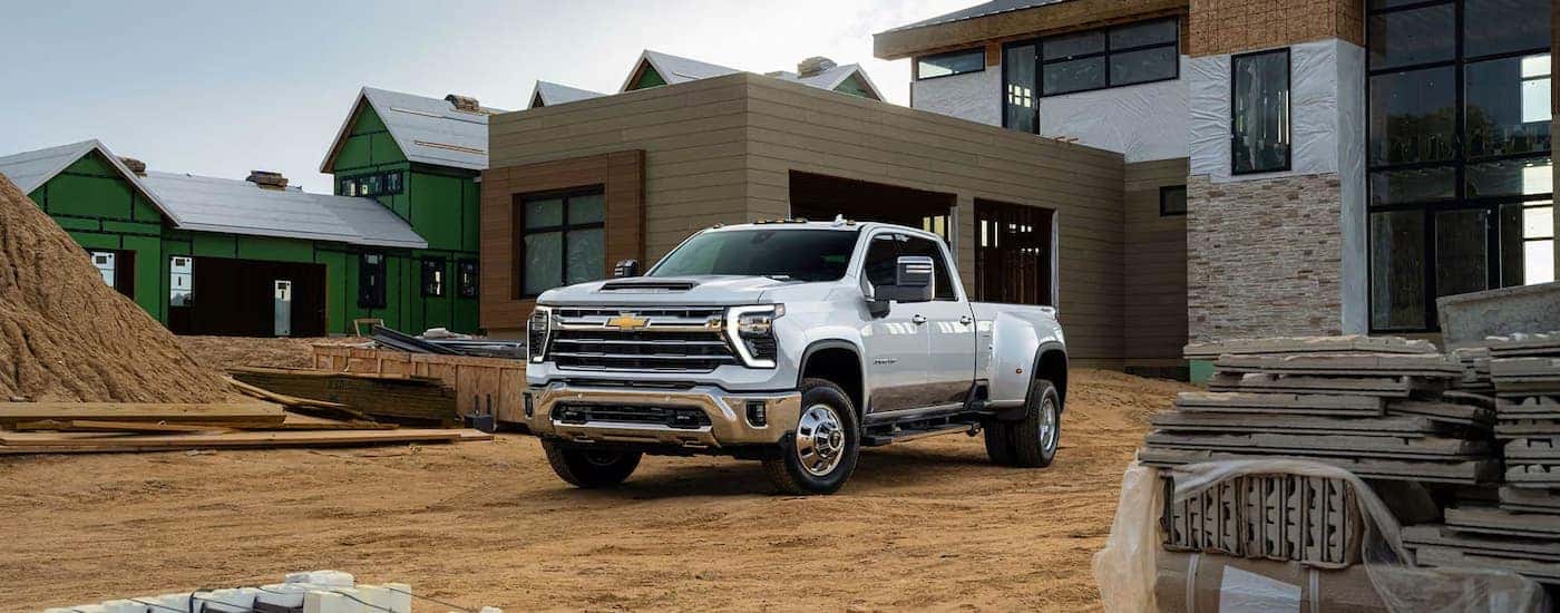 White 2026 Chevy Silverado 3500 HD parked at a construction site.