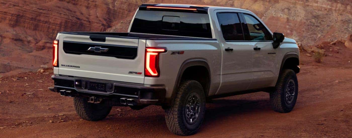 White 2027 Chevy Silverado 1500 ZR2 rear view off-road.