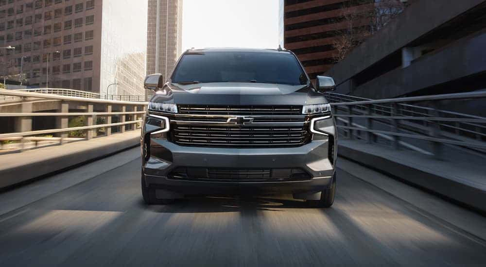 A gray 2021 Chevy Tahoe shown driving head-on.