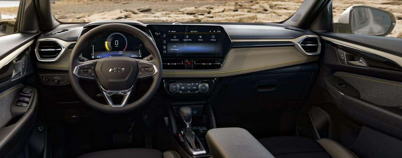 Black interior of a 2027 Chevy Trailblazer ACTIV infotainment display and steering.