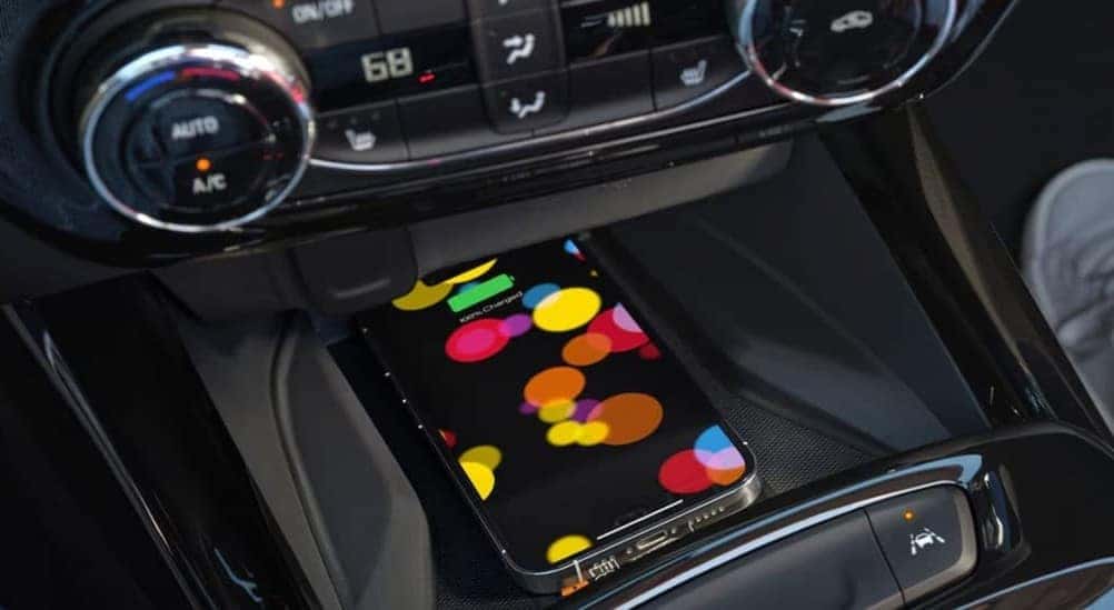 A cellphone charging in a 2026 Chevy Trax.